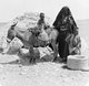 Palestine: A Bedouin woman of African origin with two children and a donkey, Al-Naqab / Negev Desert, c. 1910